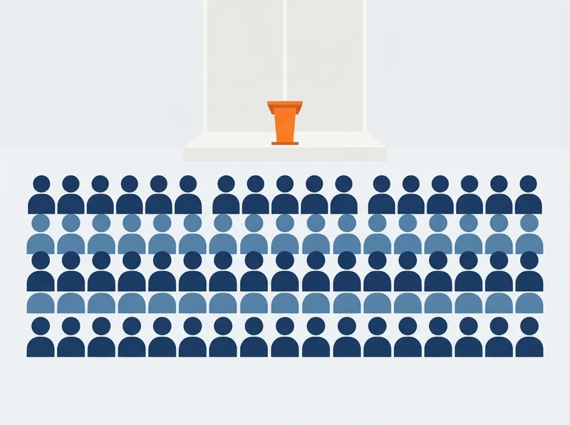 Rows of seated figures filling a public meeting room, facing a small lectern.